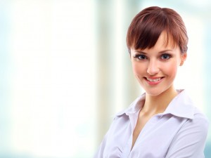 Positive business woman smiling over white background